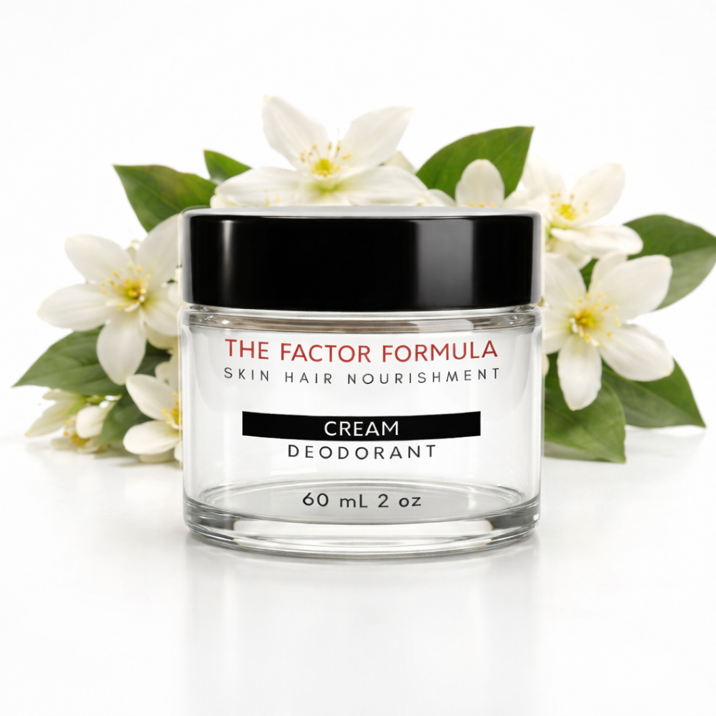 Jar of 'The Factor Formula' cream deodorant with flowers on a white background
