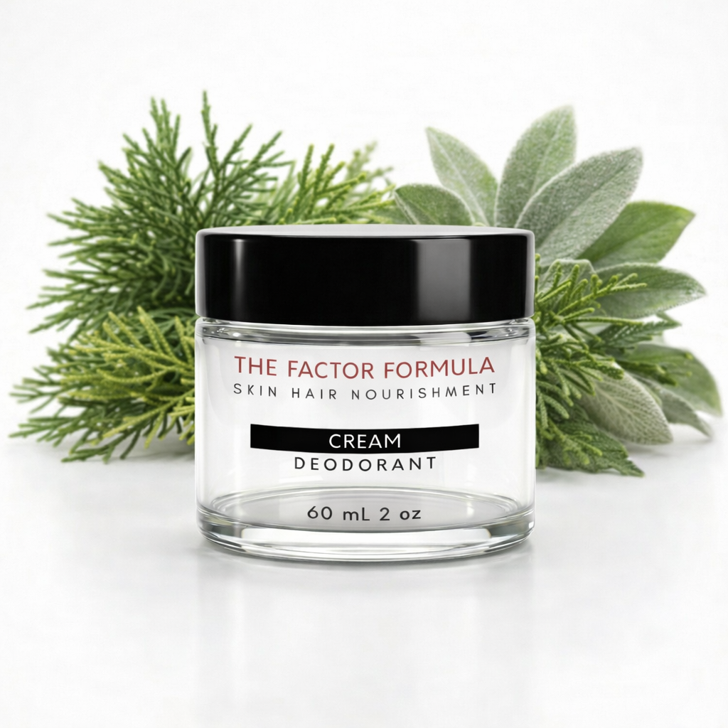 Jar of 'The Factor Formula' cream deodorant with green leaves in the background